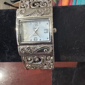 Vintage Silver Tone Quartz Watch with Intricate Design